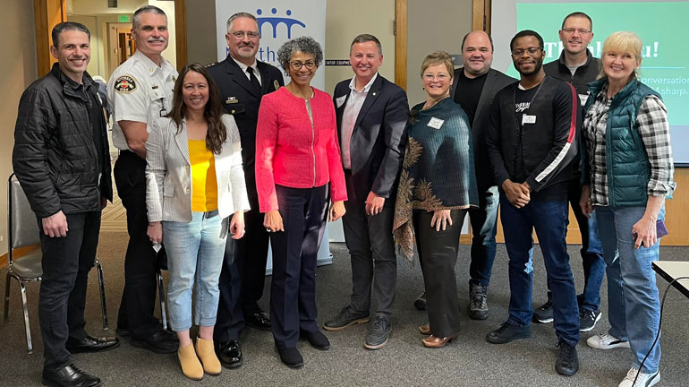 Group of people posing with Councilmember Sarah Perry.