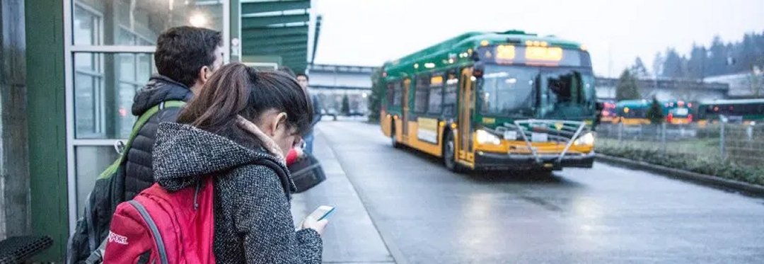 College students waiting for the bus.