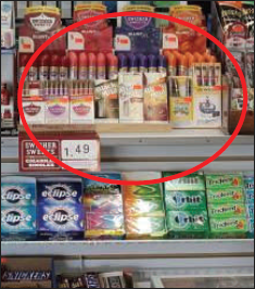 An e-cigarette display on a shelf in a store