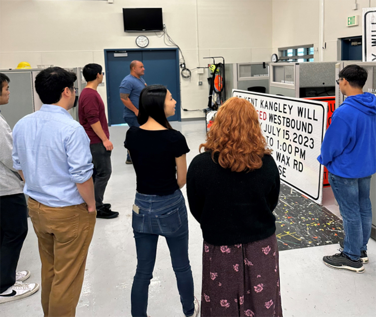 Interns on a tour of the Roads Traffic Signs and SIgns shop.