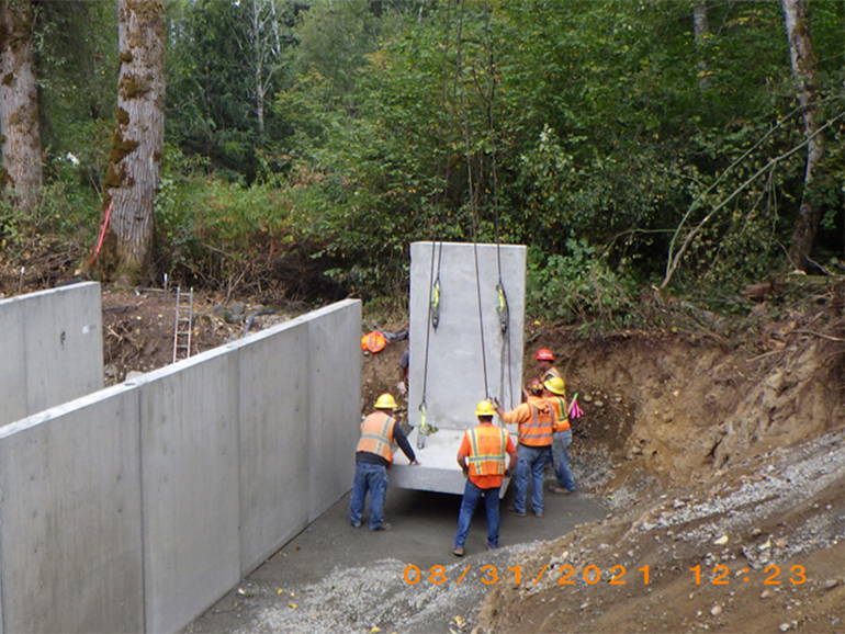 Moving last sections of concrete into place, August 31, 2021.