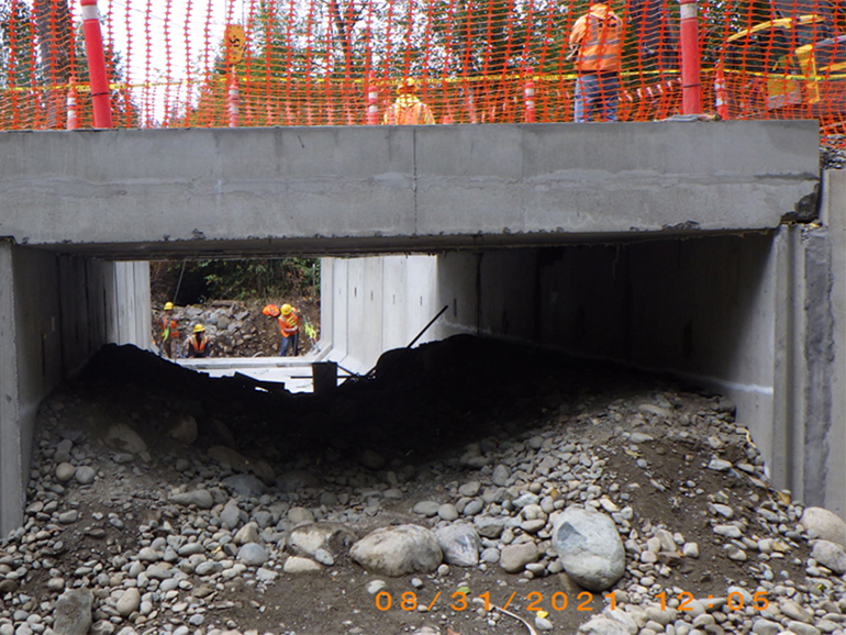 Moving last sections of concrete into place, August 31, 2021.